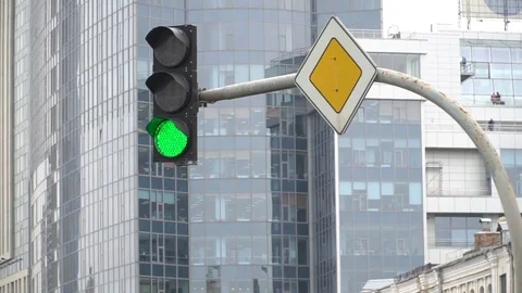 Traffic light on the background of an office building. The green light is on and Stock Footage 82170694