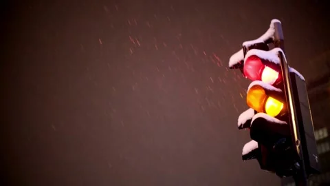Traffic light on the background of snowing. The green light is on and the Stock Footage 256737358