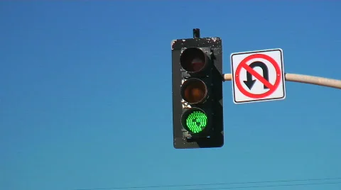 Traffic light changes in front of blue sky Stock Footage 740224
