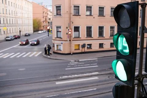 Traffic Light Changes to Green at Intersection in Urban Setting During Late Stock Photos