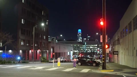 Traffic light changing at junction with San Francisco skyline in background Stock Footage 233468827