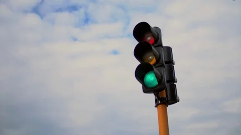 Traffic Light with cloudy wheater in background static shot, no people, w/ audio Stock Footage