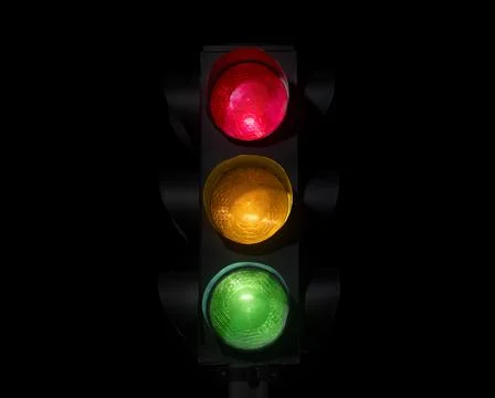 Traffic light on completely dark background Stock-Fotos