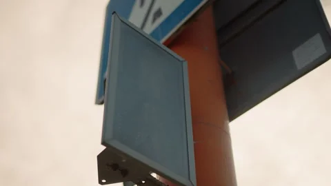 Traffic Light Countdown with Green Pedestrian Symbol on Orange Pole in City Stock Footage 305522145