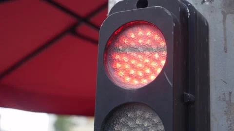 A traffic light cycles through its signals in a static shot, emphasizing Stock Footage 325310983