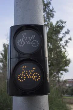 A traffic light for cyclists hangs on a pole Fotos de archivo