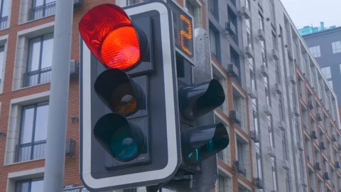 Traffic light with digital countdown at road intersection regulating a movement  Stock Footage 229837218