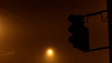 Traffic light flash yellow night fog 01 Stock Footage 98125954