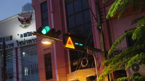 Traffic light glowing green during rain in Bangkok Stock Footage 345859797