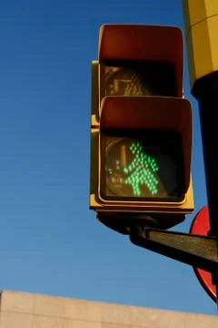 Traffic light with green female sign safe way to go. Campaign for human and w Stock Photos