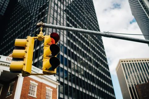 Traffic light with high building on background Stock Photos