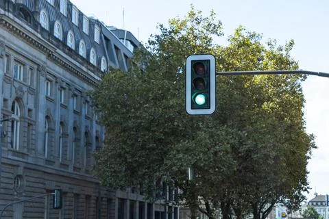 Traffic light at an intersection in the city Stock Photos