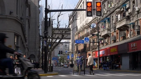 Traffic Light at the Intersection in Shanghai turns Green Cars Drive by 4k Stock Footage 122995275