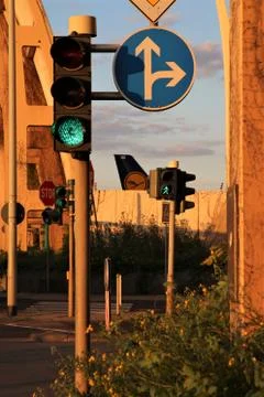 Traffic light with a Lufthansa plane tail in the background at frankfurt airp Stock Photos