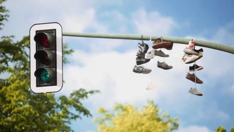 Traffic Light with Old Shoes (Loop) Stock Footage 233897990