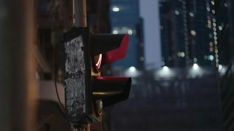 Traffic light in rain with skyscrapers at the background Видео 199632508