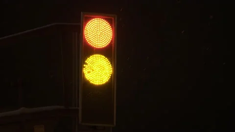 Traffic light red counting down. The night is winter it is snowing Stock Footage 166034650