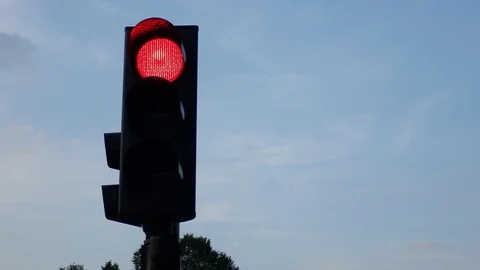 Traffic light Red only against blue sky Stock Footage 115449369