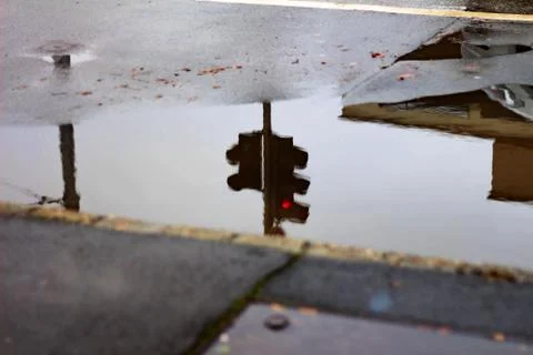 Traffic Light Reflection in the Puddle Stock Photos