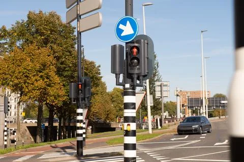 Traffic light-regulated intersection with road signs. Red traffic light Stock Photos