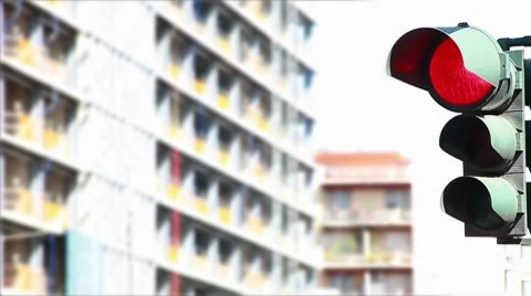 A traffic light regulating the city traffic, changing colors  Stock Footage 8564367