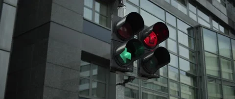 Traffic light showing direction with industrial background Stock Footage