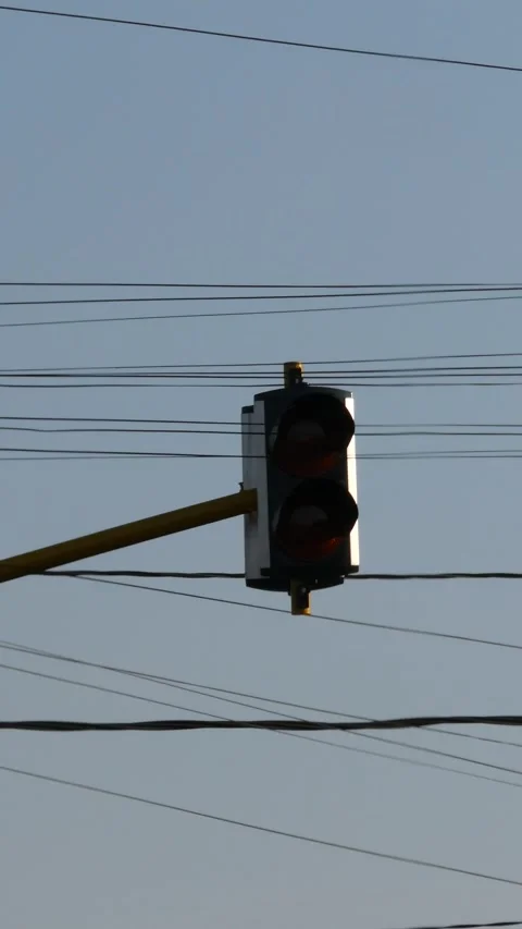 Traffic light signal changing from caution yellow to stop red with overhead.. Stock Footage 345198384