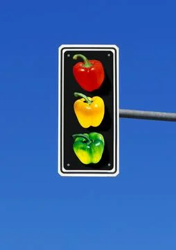 Traffic light with three bell pepper, paprika in red, yellow and green Stock Photos