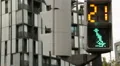 Traffic light timer counting down seconds for pedestrians to cross the street HD Footage
