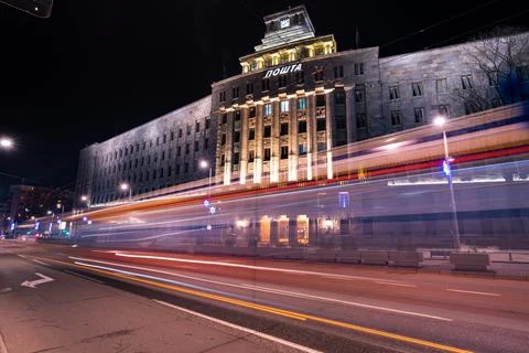 Traffic light trails in front of the largest Post office in Serbia Stock Photos