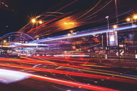 Traffic light trails on road at night in city Stock Photos