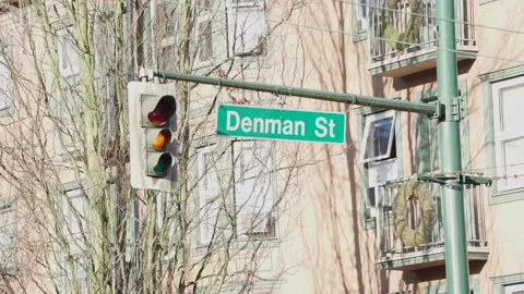 Traffic light turning from Green to Red on Denman St Vancouver Downtown Stock Footage