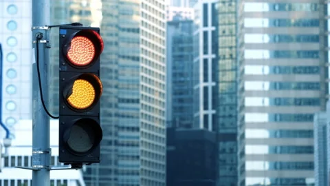 Traffic light turns from red to green at financial district intersection. Stock Footage 148899390