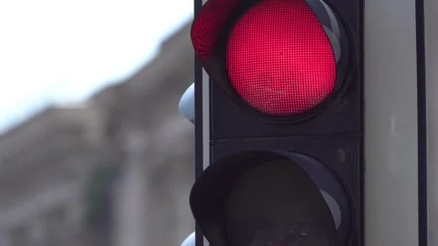 Traffic light turns from red to green amidst a city boulevard in Berlin, Stock Footage 256737825