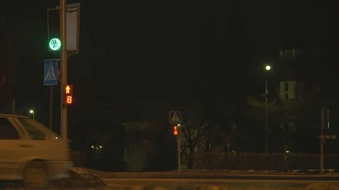 Traffic light working at night Stock Footage 76806170