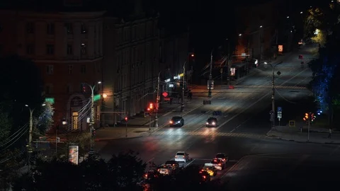 Traffic at lighted intersection or crossroad with traffic light in center or Stock Footage 115056475