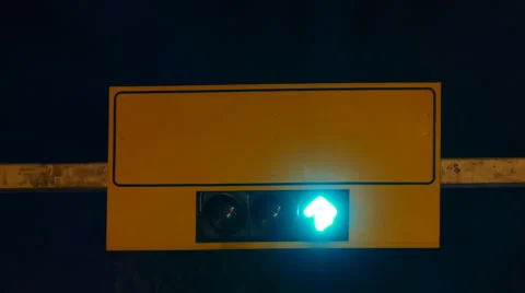 Traffic lights and an empty traffic sign table at night in time-lapse Stock Footage 55652365