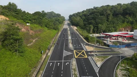 Traffic lights, junction, arrows, steep road at Persiaran Mokhtar Dahari Stock Footage 230061041