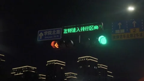 Traffic lights at night Stock Footage 163593567