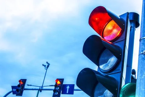 Traffic lights over urban intersection. Traffic lights over urban intersec... Stock Photos