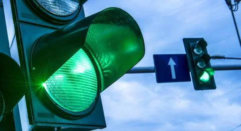 Traffic lights over urban intersection. Traffic lights over urban intersec... Stock Photos