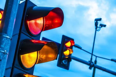 Traffic lights over urban intersection. Traffic lights over urban intersec... Stock Photos