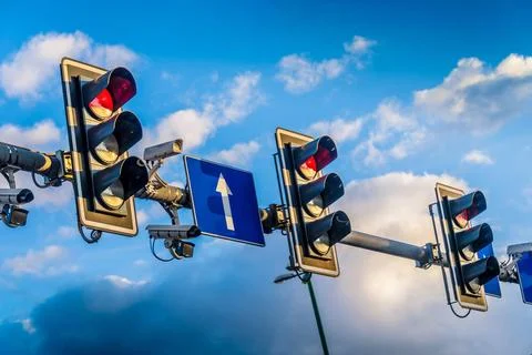 Traffic lights over urban intersection. Red light Traffic lights over urba... Stock Photos