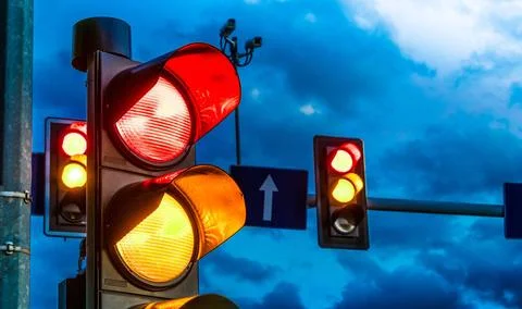 Traffic lights over urban intersection. Red light Traffic lights over urba... Stock Photos