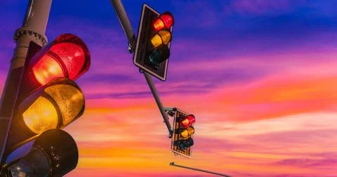 Traffic lights over urban intersection Traffic lights over urban intersect... Stock Photos