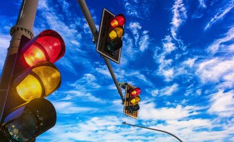 Traffic lights over urban intersection Traffic lights over urban intersect... Stock Photos