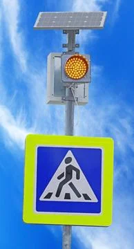 Traffic lights powered by a solar panel with a battery Stock Photos