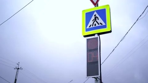 Traffic lights, red lights change to green. Crossroad. Crosswalk sign. Cloudy Stock Footage 154945639