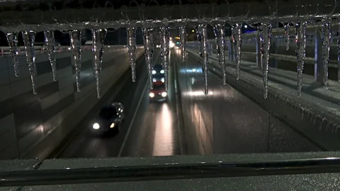 Traffic lights reflected in the formation of icicles Stock Footage 101862582