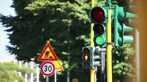 Traffic-lights regulating the city traffic, changing colors  Stock Footage 8564467